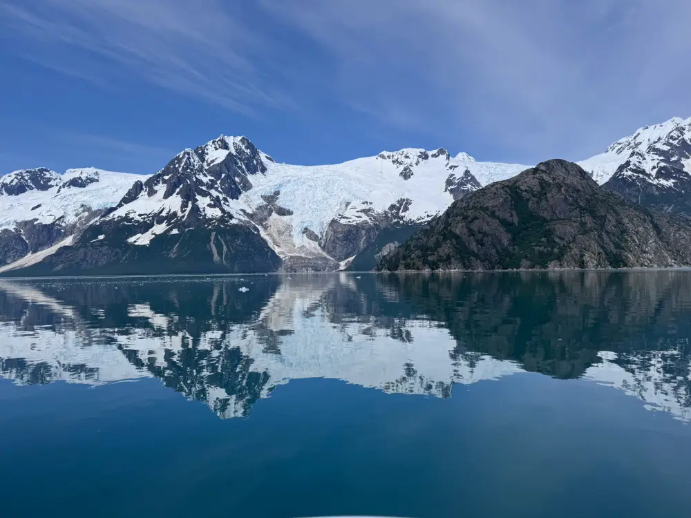A mountain lake at sunrise, shown full screen on a TV