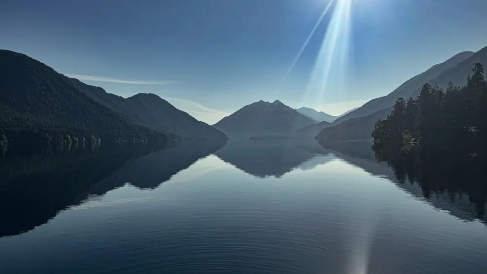 Still lake with mountain reflections